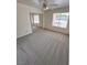 Bright bedroom with mirrored closet, neutral carpet, and large window provides ample natural light at 7255 W La Madre Way, Las Vegas, NV 89149