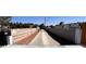 Wide driveway with ample parking and privacy gates at 7255 W La Madre Way, Las Vegas, NV 89149