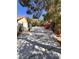 Exterior view of the property with ample space for parking at 7255 W La Madre Way, Las Vegas, NV 89149
