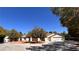 Charming single-story home with mature trees and a spacious driveway at 7255 W La Madre Way, Las Vegas, NV 89149