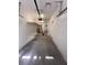 Spacious garage featuring high ceilings, overhead storage racks, and ample room for vehicles and storage at 7255 W La Madre Way, Las Vegas, NV 89149