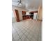Bright and airy kitchen featuring tile floors, stainless steel appliances, and ample cabinet space at 7255 W La Madre Way, Las Vegas, NV 89149