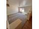 A bright living room with neutral carpet, staircase, and abundant natural light at 7255 W La Madre Way, Las Vegas, NV 89149