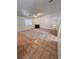 Spacious living room features a fireplace, ceiling fan, neutral carpet, and flows into the tiled entry at 7255 W La Madre Way, Las Vegas, NV 89149