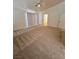Spacious primary bedroom with neutral carpet, large window, and en-suite bathroom at 7255 W La Madre Way, Las Vegas, NV 89149
