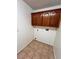 Ample storage space with tile flooring and natural wood storage cabinets at 7255 W La Madre Way, Las Vegas, NV 89149