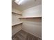 Spacious walk-in closet with carpeted floor and open shelving system for easy organization at 7255 W La Madre Way, Las Vegas, NV 89149
