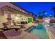 Serene backyard with a pool, spa, and outdoor seating beneath a covered patio, perfect for relaxing at 733 Secret London Ave, Las Vegas, NV 89178
