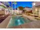 Inviting spa surrounded by lush landscaping and a well-manicured lawn offering a serene outdoor experience at 733 Secret London Ave, Las Vegas, NV 89178