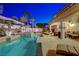 Pool and spa with an outdoor patio area for lounging and entertaining, all surrounded by lush greenery at 733 Secret London Ave, Las Vegas, NV 89178