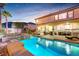 Beautiful backyard with a sparkling pool, jacuzzi, and covered patio lounge area at 733 Secret London Ave, Las Vegas, NV 89178