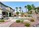 Expansive backyard with sparkling pool, spa, mature trees, and stone accents at 733 Secret London Ave, Las Vegas, NV 89178