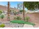 Lush landscaped backyard with terraced planting beds and decorative rock at 733 Secret London Ave, Las Vegas, NV 89178