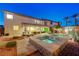 Inviting backyard with a pool, spa, and outdoor lounge area, perfect for relaxing and entertaining at 733 Secret London Ave, Las Vegas, NV 89178