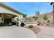 Beautiful backyard featuring a pool, spa, patio area with seating and a retaining wall with landscaping at 733 Secret London Ave, Las Vegas, NV 89178