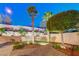 Backyard with a brick-paved path, lush greenery, and mature trees for a serene outdoor setting at 733 Secret London Ave, Las Vegas, NV 89178
