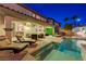 Relaxing backyard featuring a pool, lounge chairs, an outdoor dining area, and well-maintained landscaping at 733 Secret London Ave, Las Vegas, NV 89178