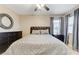 Bedroom features a patterned bedspread, bedside tables, and a large mirror at 733 Secret London Ave, Las Vegas, NV 89178