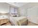 Cozy bedroom with a large window, closet, and a comforting interior design at 733 Secret London Ave, Las Vegas, NV 89178