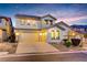 Charming two-story home with desert landscaping and a two car garage, offering curb appeal at 733 Secret London Ave, Las Vegas, NV 89178