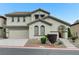 Charming two-story home featuring desert landscaping and attached two car garage at 733 Secret London Ave, Las Vegas, NV 89178