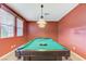 Large game room featuring a pool table with overhead lighting and natural light at 733 Secret London Ave, Las Vegas, NV 89178