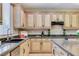 This kitchen boasts granite countertops, lots of cabinet space, recessed lighting, and modern fixtures at 733 Secret London Ave, Las Vegas, NV 89178