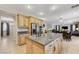 Open kitchen island boasts granite countertops and stainless appliances at 733 Secret London Ave, Las Vegas, NV 89178