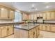Eat-in kitchen boasts granite countertops, stainless appliances, and a view to the back yard at 733 Secret London Ave, Las Vegas, NV 89178