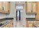 Gourmet kitchen features stainless steel appliances, stone countertops, and an open floor plan at 733 Secret London Ave, Las Vegas, NV 89178