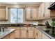 Bright kitchen features stone countertops and stainless steel appliances at 733 Secret London Ave, Las Vegas, NV 89178