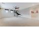 Large, bright living room with high ceilings, windows and recessed lighting at 733 Secret London Ave, Las Vegas, NV 89178