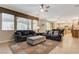 Bright living room features tile floors, contemporary furniture, and a view of the landscaped backyard at 733 Secret London Ave, Las Vegas, NV 89178