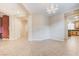 Open-concept living space with tile floors, neutral paint, and modern lighting fixtures at 733 Secret London Ave, Las Vegas, NV 89178