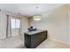 Comfortable office space featuring a large desk, neutral walls, carpeted flooring, and ample natural light at 733 Secret London Ave, Las Vegas, NV 89178