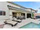 Amazing backyard with a covered patio, pool, spa, and ample seating perfect for relaxing at 733 Secret London Ave, Las Vegas, NV 89178