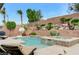 Backyard featuring a beautiful pool with an integrated spa and mature landscaping at 733 Secret London Ave, Las Vegas, NV 89178