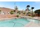 Sparkling pool and spa area with lush landscaping and a brick retaining wall for added privacy at 733 Secret London Ave, Las Vegas, NV 89178