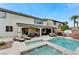 Stunning backyard showcasing a private pool, spa, covered patio, and lush landscaping at 733 Secret London Ave, Las Vegas, NV 89178