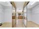 Dual walk-in closets and bathroom with tub and vanity at 733 Secret London Ave, Las Vegas, NV 89178
