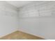 Walk-in closet with shelves, white walls, and carpeted floor ready for organizing clothes, shoes, and accessories at 733 Secret London Ave, Las Vegas, NV 89178