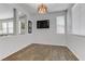 Bright bonus room with wood-look tile floors and neutral walls, ready for your personal touch at 7609 Trimming Ct, Las Vegas, NV 89149
