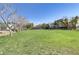 View of grassy field in the park with sparse trees and a covered picnic area at 7609 Trimming Ct, Las Vegas, NV 89149
