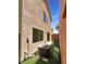 Side view of backyard, showing AC unit and wall, featuring artificial grass at 7873 Running Doe Ct, Las Vegas, NV 89149