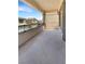 Covered balcony space with tiled flooring and decorative railings offers a spot for relaxing outdoors at 7873 Running Doe Ct, Las Vegas, NV 89149