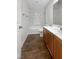 Clean bathroom with wood-look tile floors, a single vanity, and a tub-shower combination at 7873 Running Doe Ct, Las Vegas, NV 89149