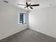 Bedroom featuring carpeted floors, neutral paint and a ceiling fan at 7873 Running Doe Ct, Las Vegas, NV 89149