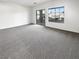 Spacious bedroom featuring a sliding glass door, a window, and carpet floors at 7873 Running Doe Ct, Las Vegas, NV 89149