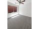 Bedroom featuring neutral carpet, ceiling fan, and ample natural light from the window at 7873 Running Doe Ct, Las Vegas, NV 89149