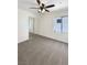 Bedroom with carpet, ceiling fan and mirrored closet doors and natural light at 7873 Running Doe Ct, Las Vegas, NV 89149